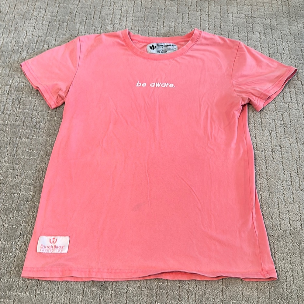 Dutch Bros Women’s tee shirt medium pink. “ Be aware” quote.
